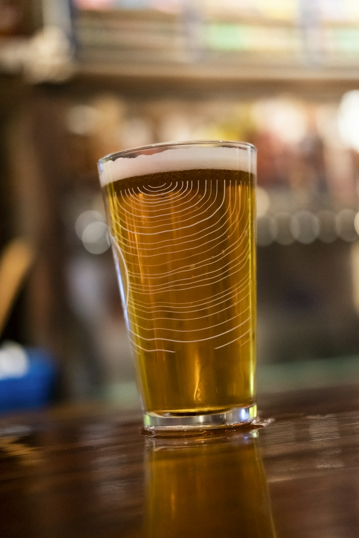 Editorial photograph of a glass of beer at a bar; illustrative, not EAT's premises